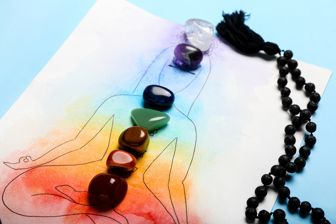 Drawing of Human, Set of Chakra Stones and Beads on Color Background